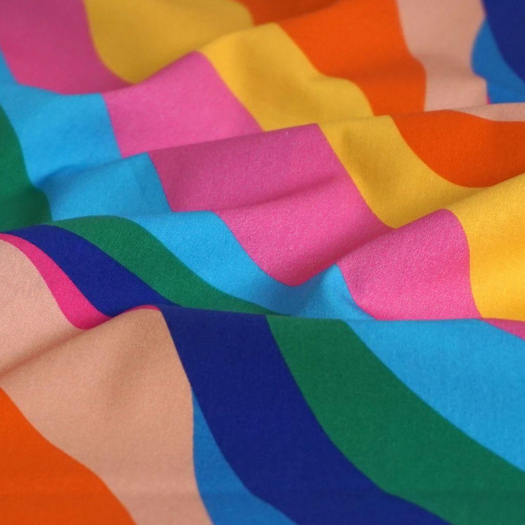 Baumwollstoff Motivdruck Wellen regenbogenbunt